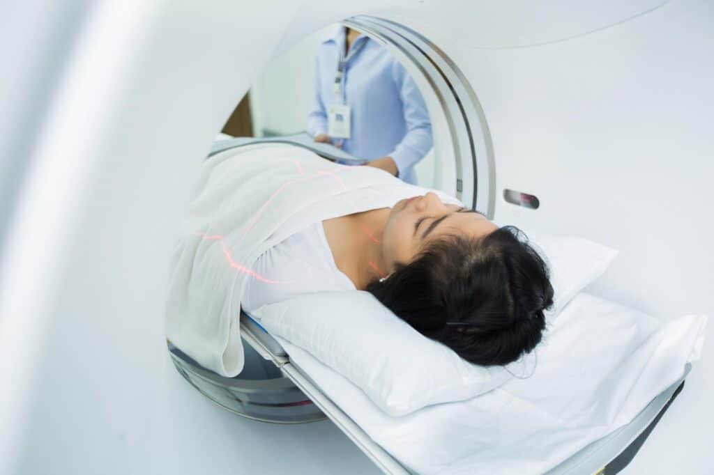A woman undergoing a radiology test